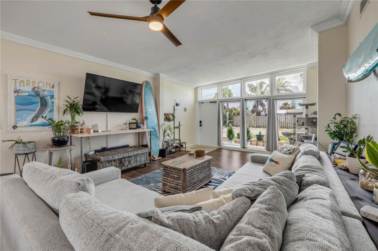 Photo 7 of 20: Living room with generous windows and natural light.