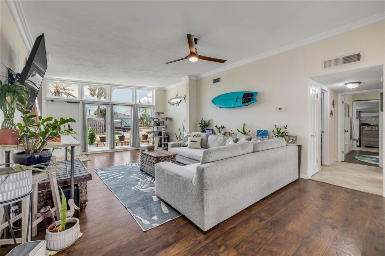 Photo 2 of 20: Living area with wood flooring and views toward the front windows.