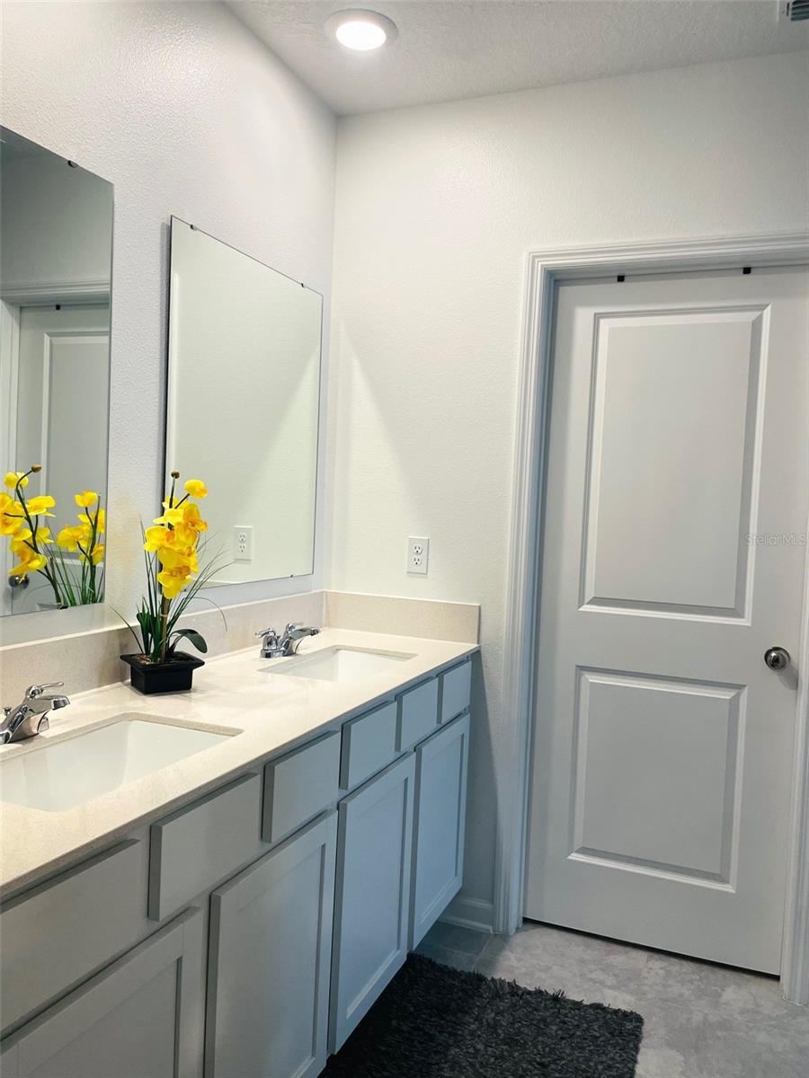 Photo 19 of 20: Primary Bathroom Quartz Vanity w/ double sinks