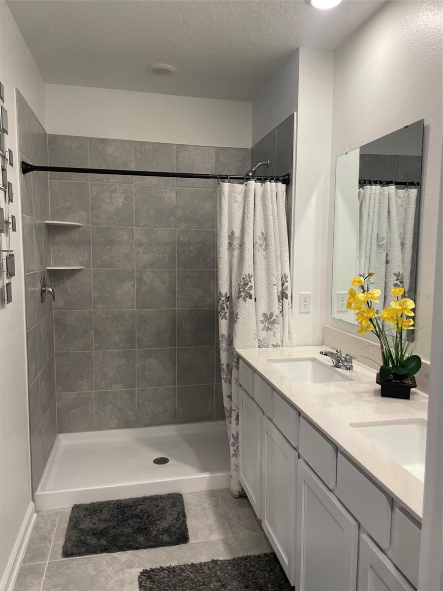 Photo 16 of 20: Primary Bathroom w/ Walk-in Shower
