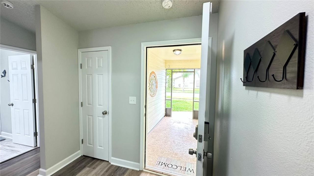 Photo 18 of 20: View of front door with guest rooms/bath to left including a privacy wall and hall closet!