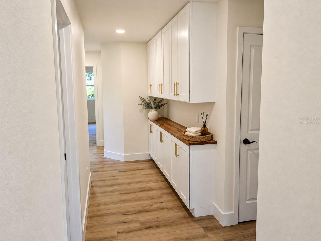 Photo 12 of 20: breakfast bar/ storage cabinetry Virtually staged