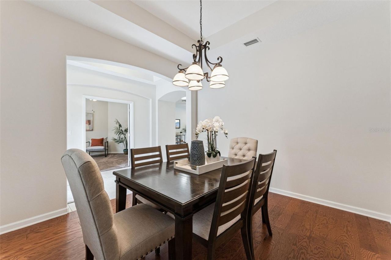 Photo 7 of 20: View from the Dining Room to Foyer entryway & Den/office area