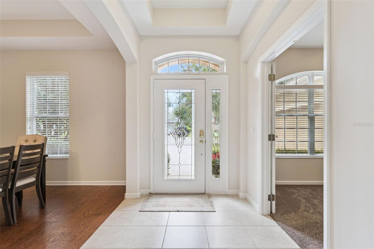Photo 3 of 20: Foyer entryway w/ tray ceiling & leaded glass front door