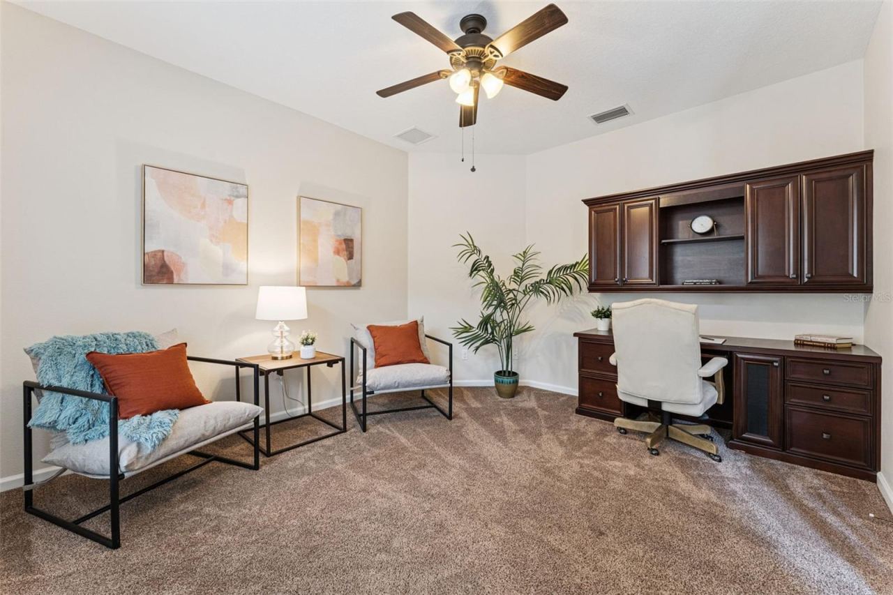 Photo 4 of 20: 12' x 14' Den/office w/ built-in desk, ceiling fan & double door entry