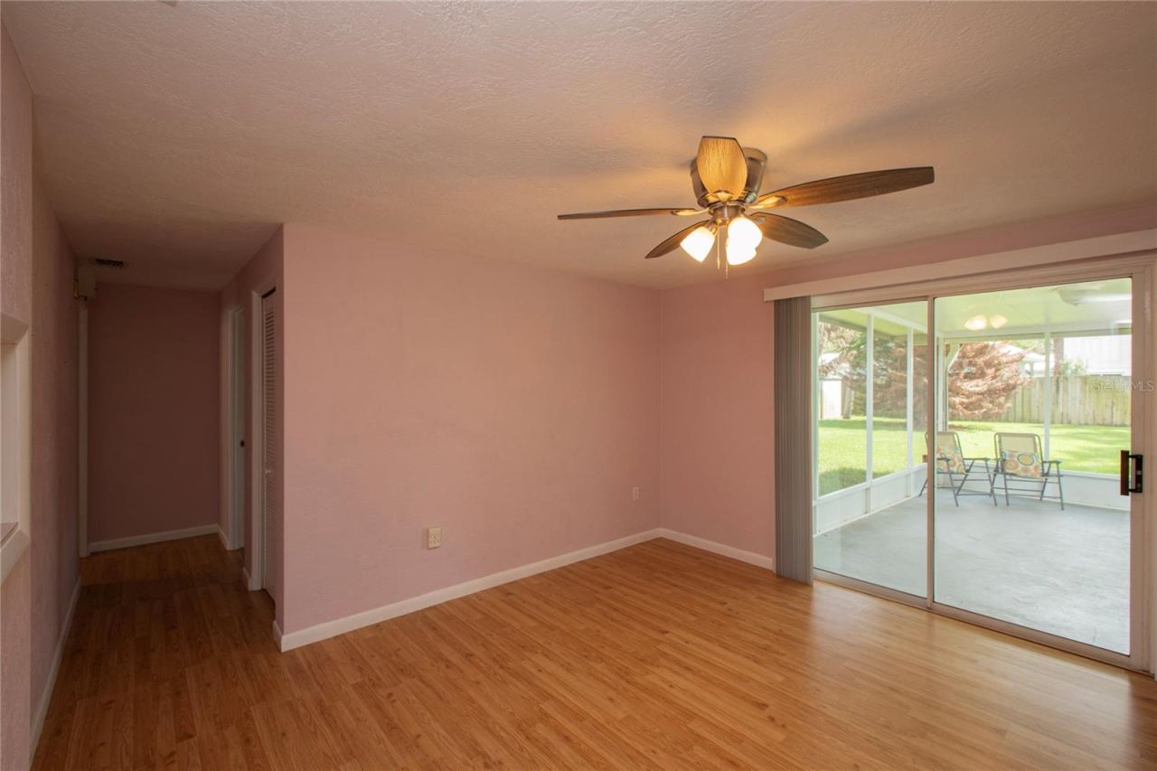 Photo 7 of 20: FAMILY ROOM, HALLWAY TO BEDROOM, SCREENED PORCH
