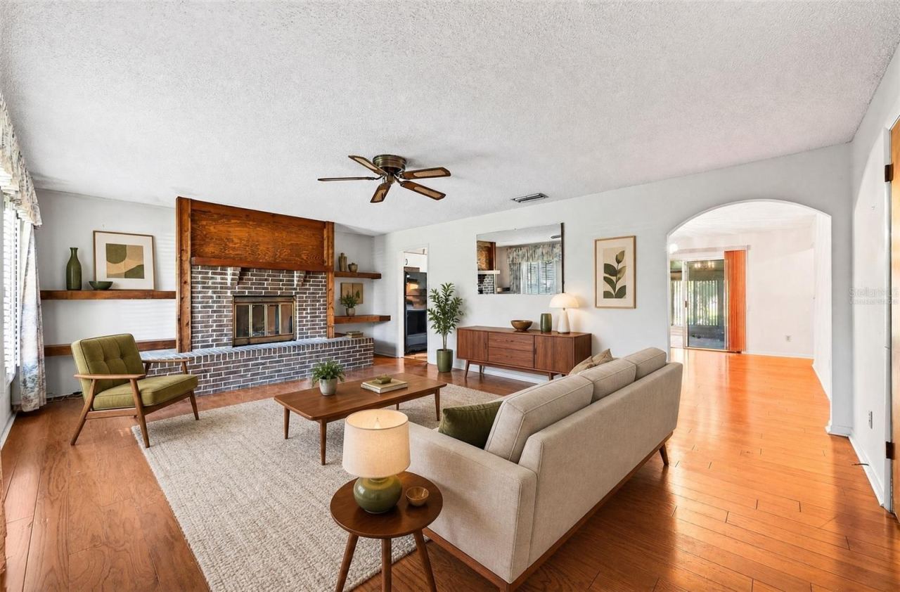 Photo 2 of 20: Living room has access to the kitchen and dining room. Virtually Staged.