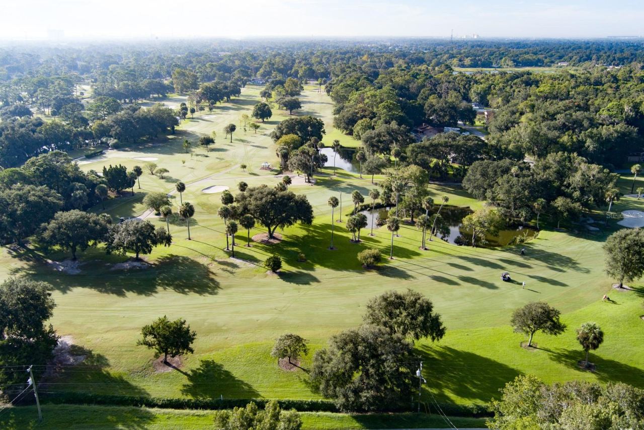 Photo 4 of 20: Aerial with Adjacent Riviera Country Club