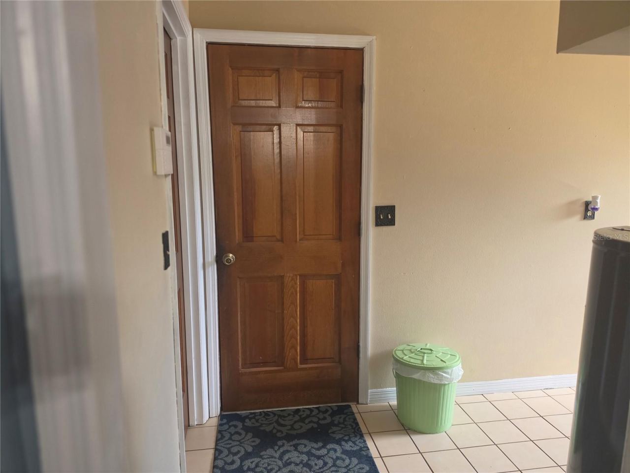 Photo 18 of 20: Interior door to the garage in laundryy room