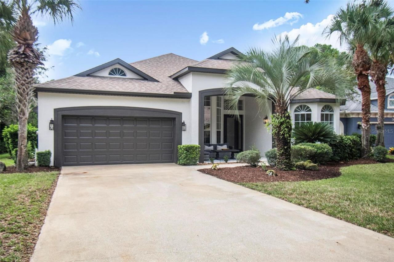 Photo 2 of 20: Stylish curb appeal of the front of this beautiful home with a nice long driveway