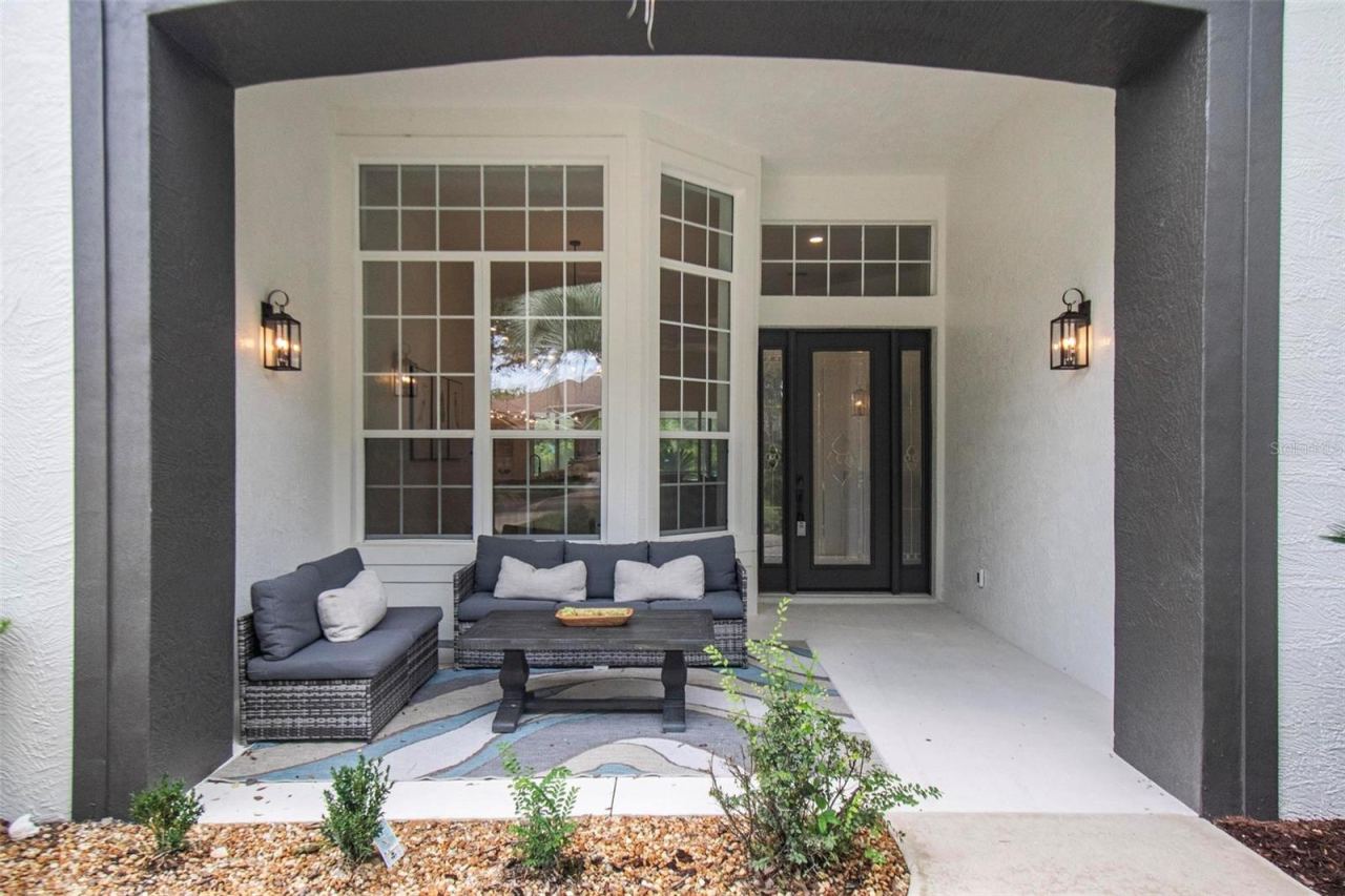 Photo 4 of 20: Large seating area of covered front porch to enjoy morning coffee or an evening conversation with your neighbors and friends