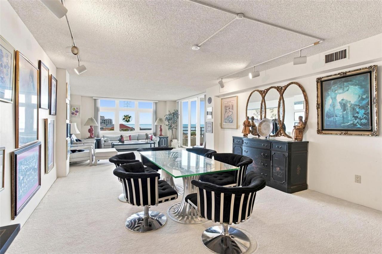 Photo 14 of 20: Open Living Space. Dining and Living Area with sliders leading to balcony with ocean view.