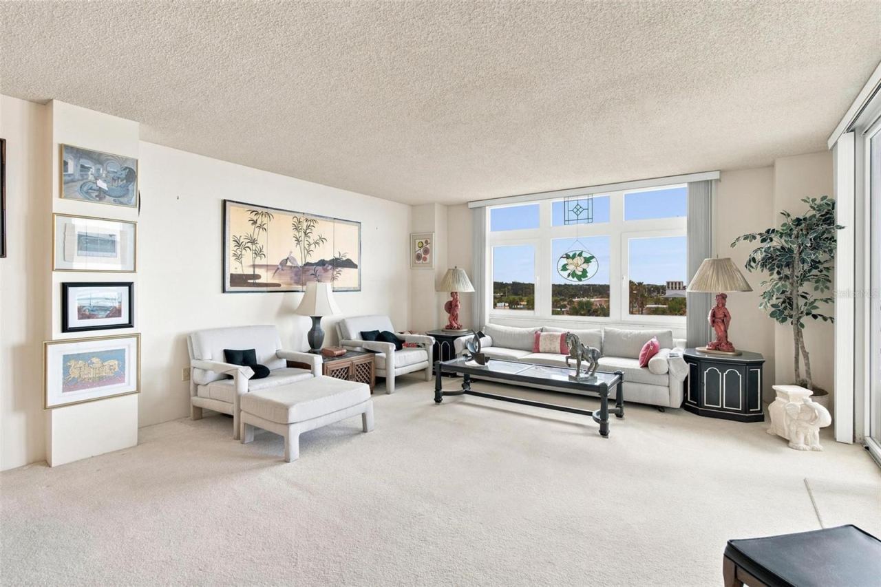 Photo 15 of 20: Open Living Space. Dining and Living Area with sliders leading to balcony with ocean view.