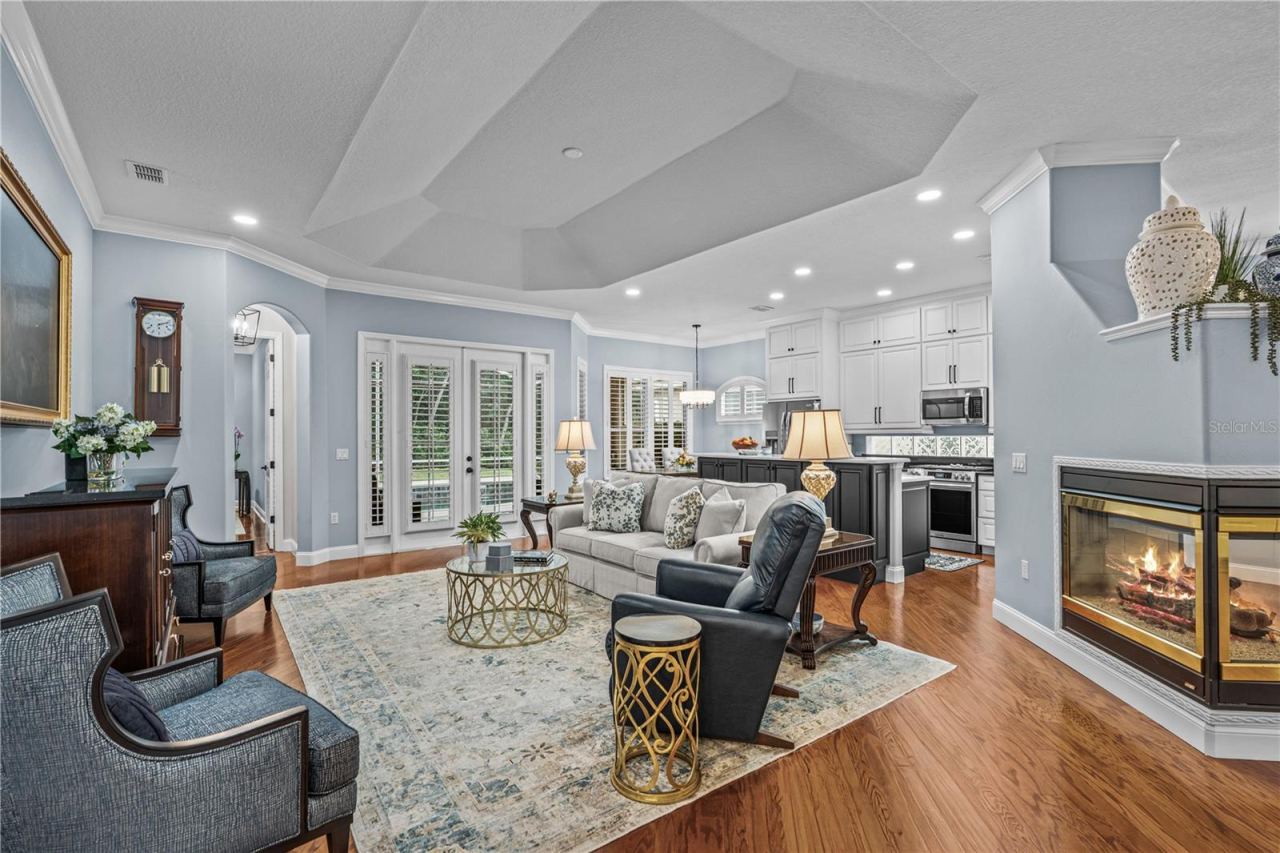 Photo 13 of 20: Great room which is open to the kitchen with French doors out to the lanai