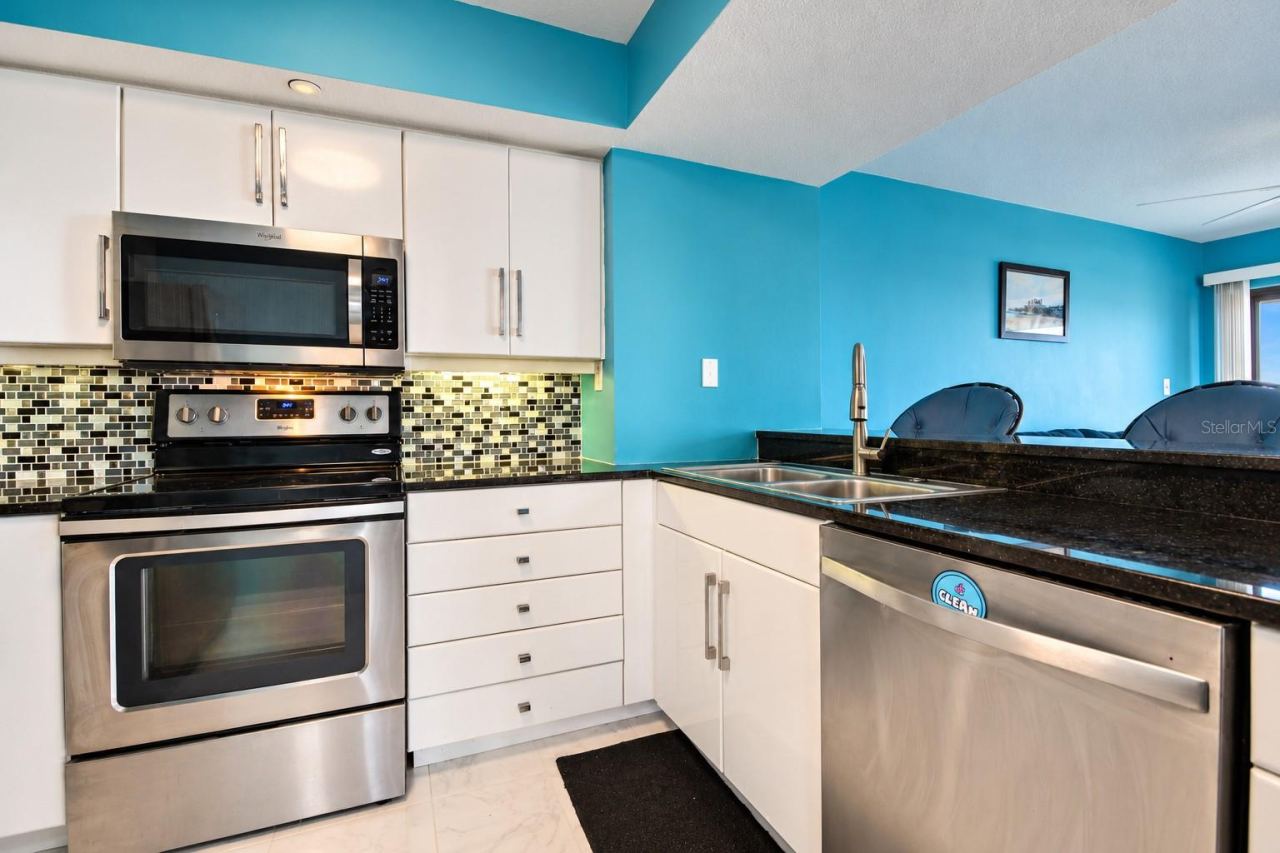 Photo 15 of 20: Kitchen has granite counters and stainless appliances.