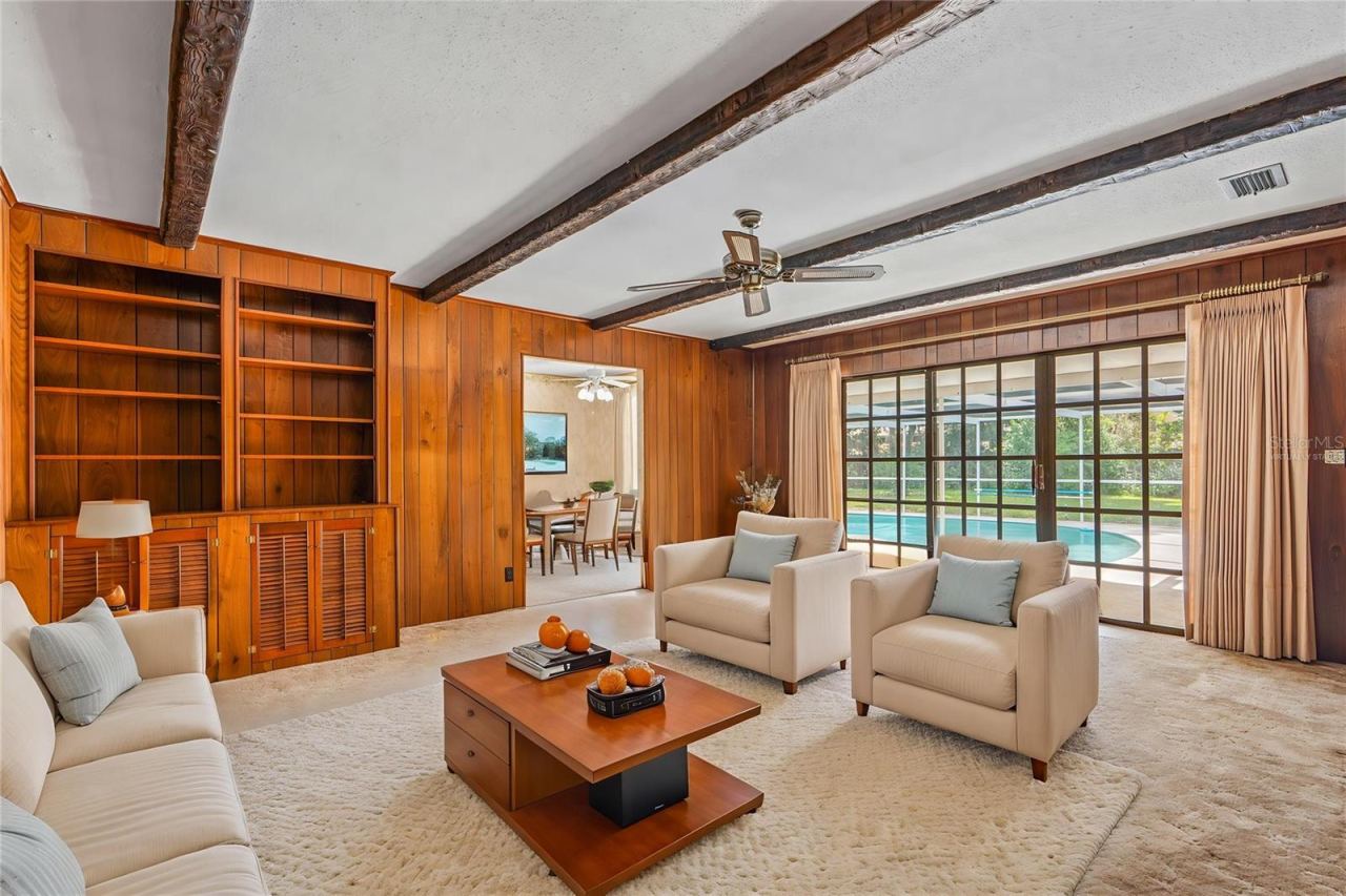 Photo 19 of 20: Virtually Staged - Family Room Overlooks Pool