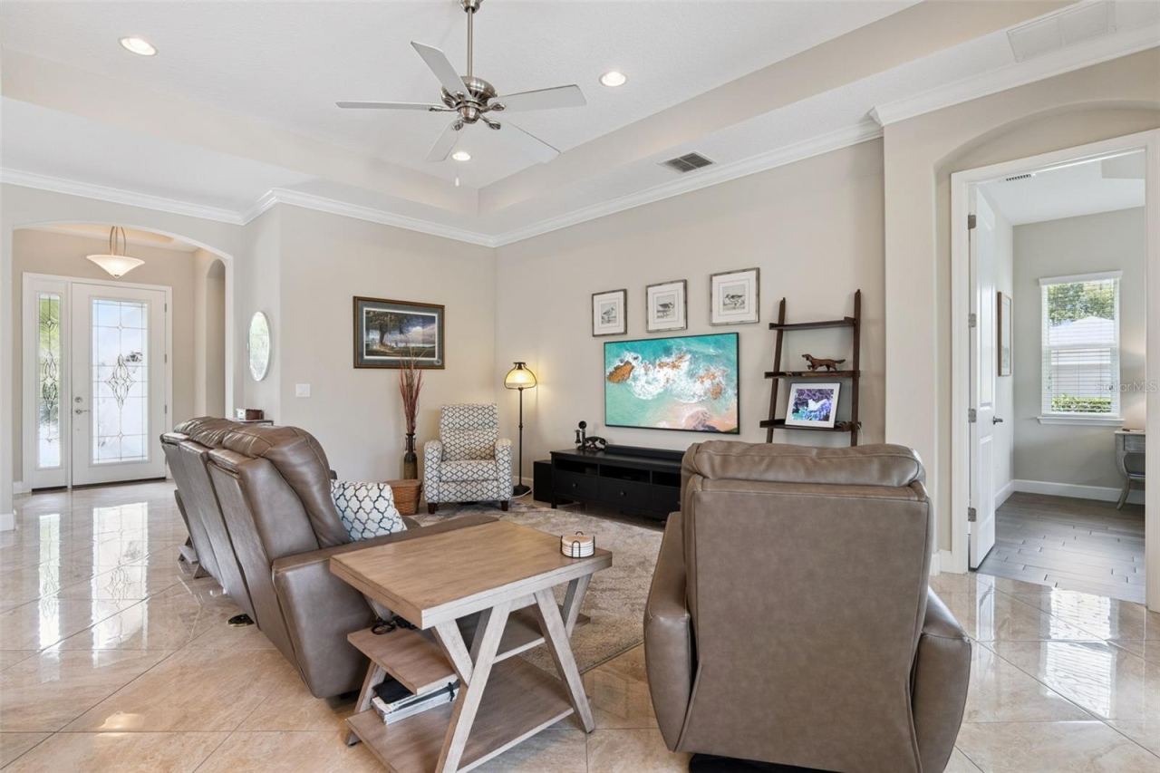 Photo 7 of 20: View of Great Room w/ spacious entertainment wall & Foyer entryway