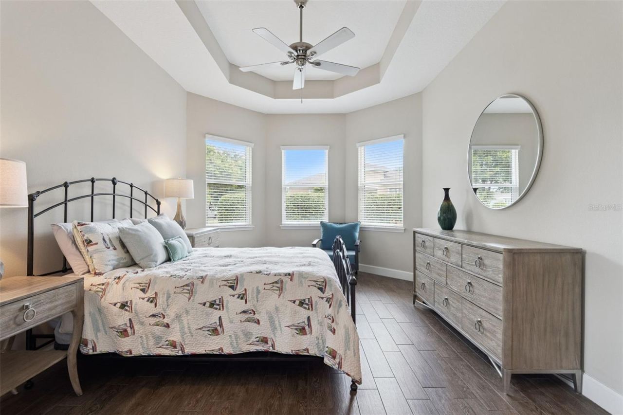 Photo 16 of 20: Primary Bedroom w/ multiple windows for natural light