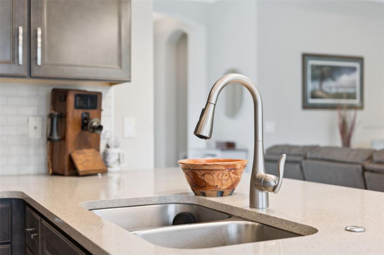 Photo 11 of 20: Kitchen w/ Quartz countertop, stainless steel sink & faucet w/ pull-out sprayer