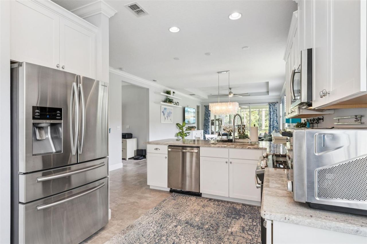 Photo 8 of 20: Kitchen w/ a French door style refrigerator & all stainless steel appliances