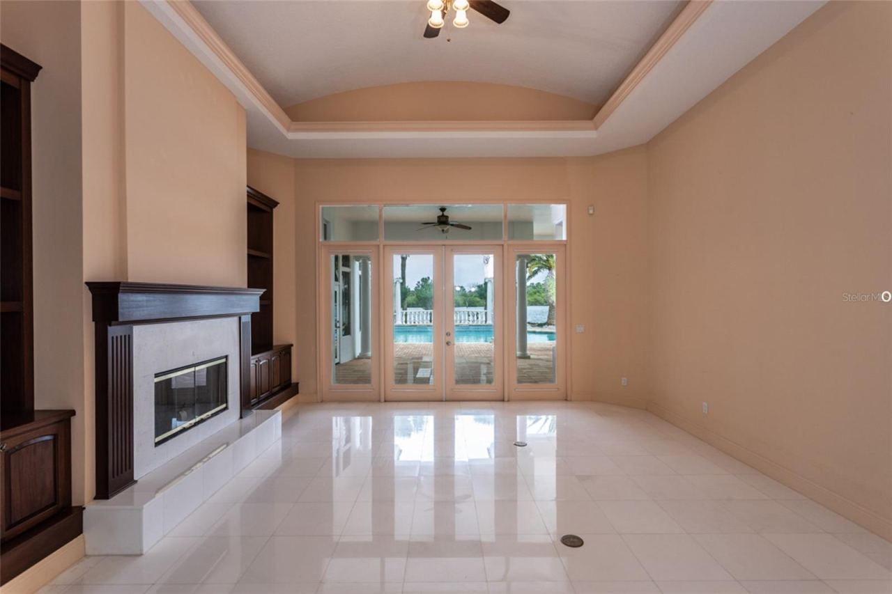 Photo 11 of 20: Living Room With French Doors Open To The Covered Patio