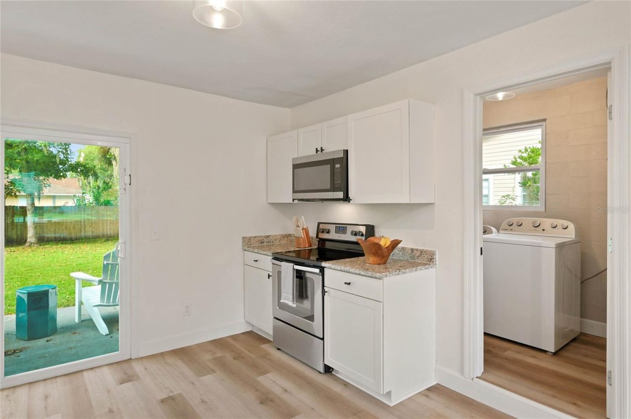 Photo 11 of 20: kitchen to laundry and storage space