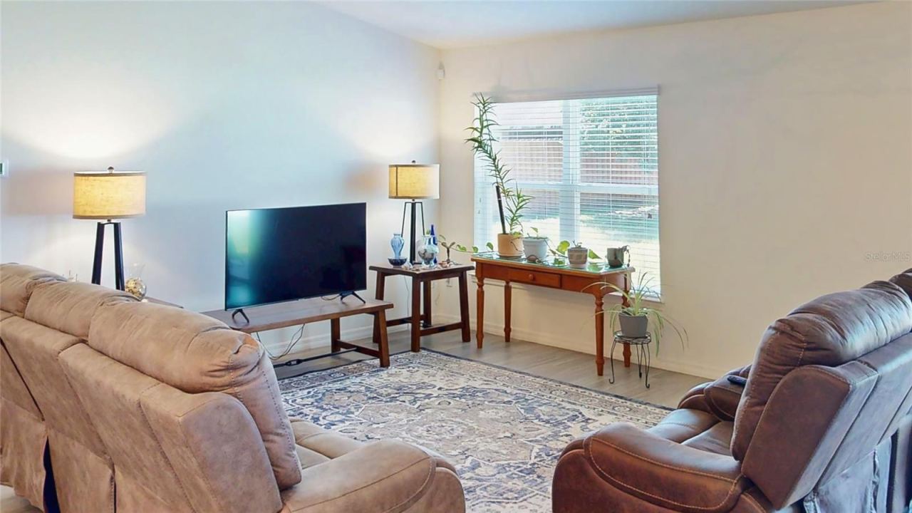 Photo 8 of 20: Another view of a living room. Come up with verbiage that is different than previous about this living room space. Keep it short; it's just a description for a photo.