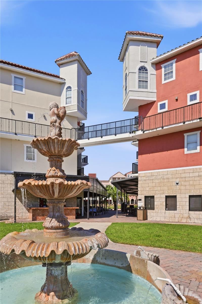 Photo 2 of 20: The Breakfast Nook of 418B occupies the distinctive top-floor corner tower shown on the right, overlooking the European Village courtyard.