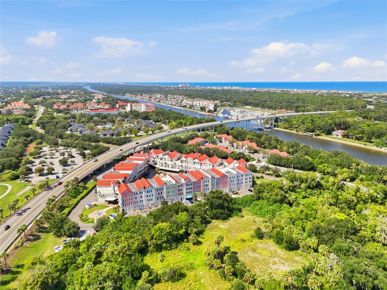 Photo 1 of 20: European Village-Residence 418B is located at the left corner in this aerial view, across from the Intracoastal Waterway and approximately a 5-minute drive to the Atlantic Ocean.