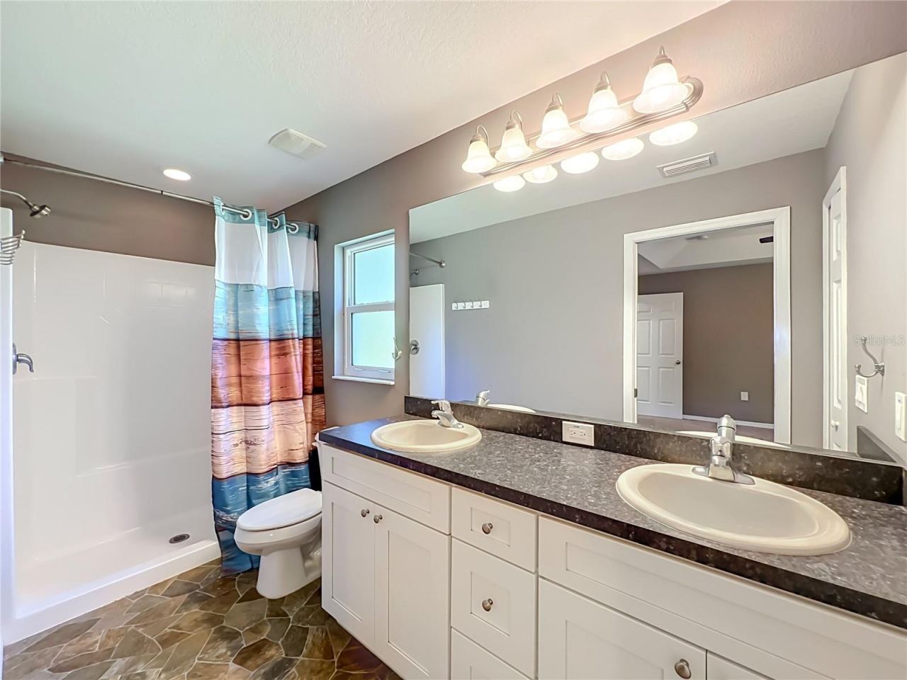 Photo 17 of 20: Primary Bath Complete with Double Sinks