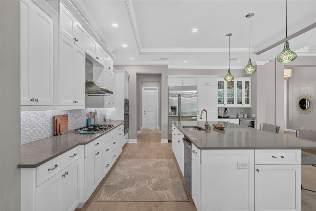 Photo 6 of 20: A kitchen that invites you to stay awhile—generous prep space, refined finishes, and an oversized island create a natural gathering place for everything from morning coffee to evenings with friends.