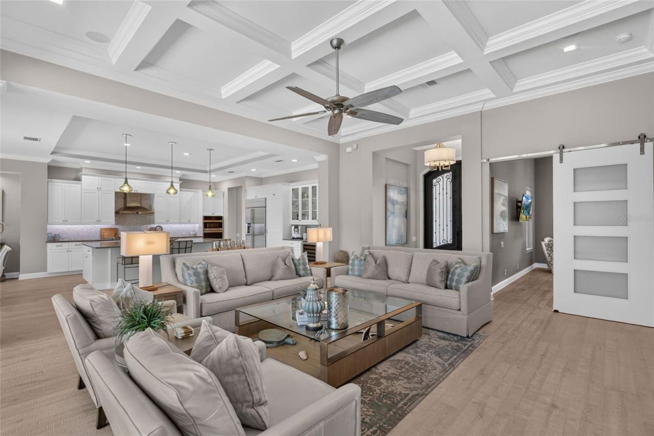 Photo 17 of 20: Every detail has a purpose here—from the sculpted ceiling and statement barn door to the graceful transition between rooms, giving the home a custom character you simply don’t find everywhere.