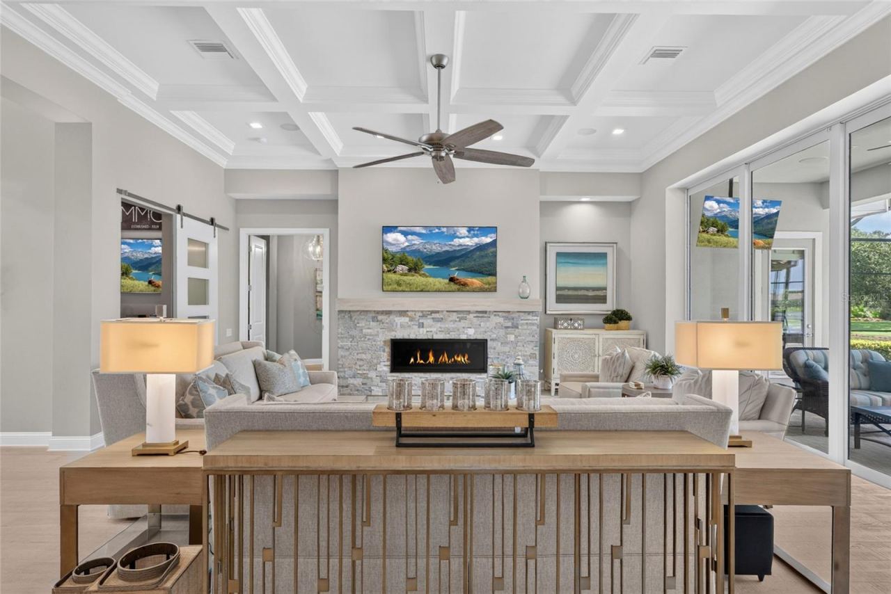 Photo 5 of 20: Picture yourself unwinding here at the end of the day, glowing stacked-stone gas fireplace and the beautiful boxed-beam ceiling overhead—this is the kind of room that simply feels like home