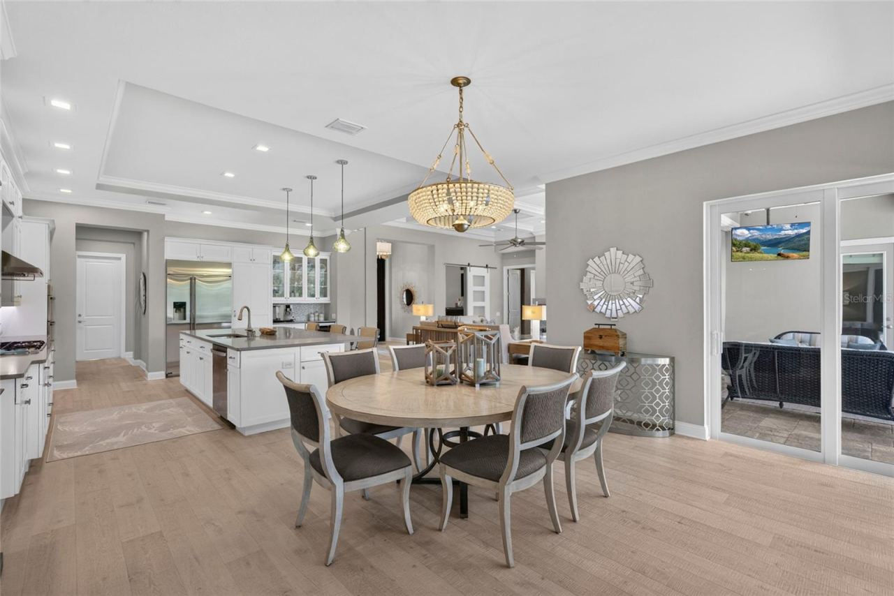 Photo 18 of 20: Here, dining feels beautifully connected to the day around it—sunlight, easy access to the lanai, and a kitchen just steps away make lingering at the table feel completely natural.