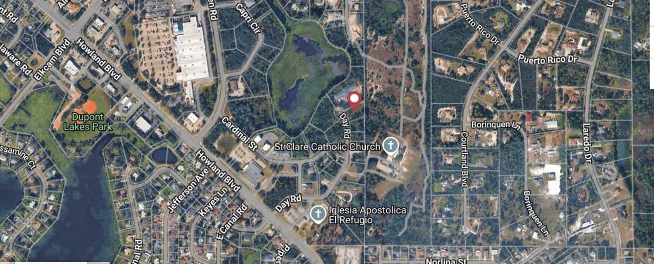 Photo 1 of 4: Aerial view of the 2991 Day Road multifamily development site. Property boundary lines are approximate.
