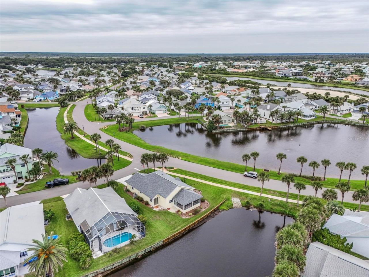 Photo 16 of 20: Intracoastal at top of picture-canal in front-Lake view with fountain in front of house and canal behind. Beautiful water views-Watch nature! Hear the waves!