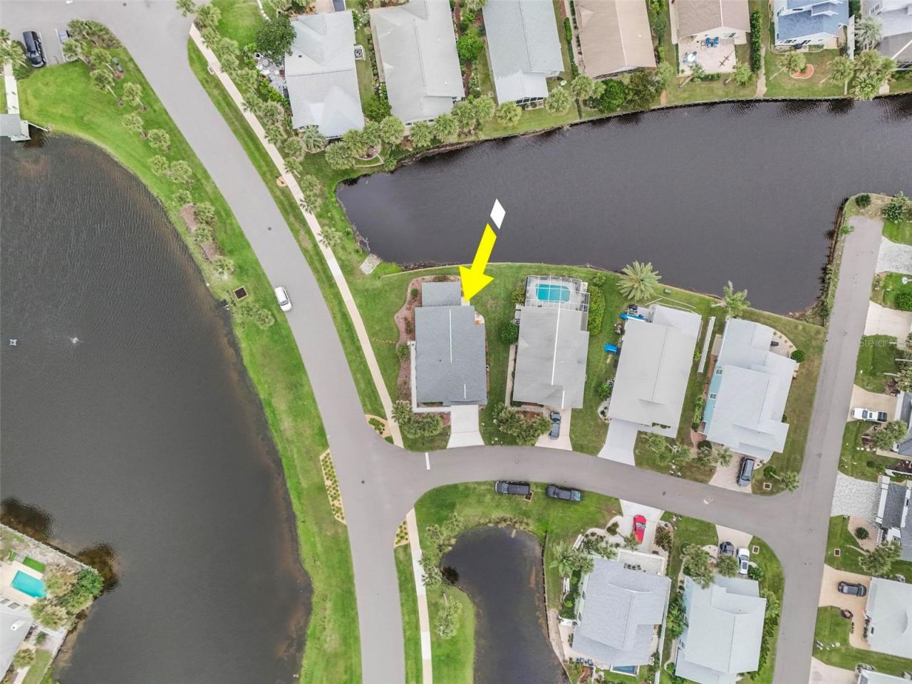 Photo 3 of 20: View of lake across the street and canal in front canal in back steps to ocean
