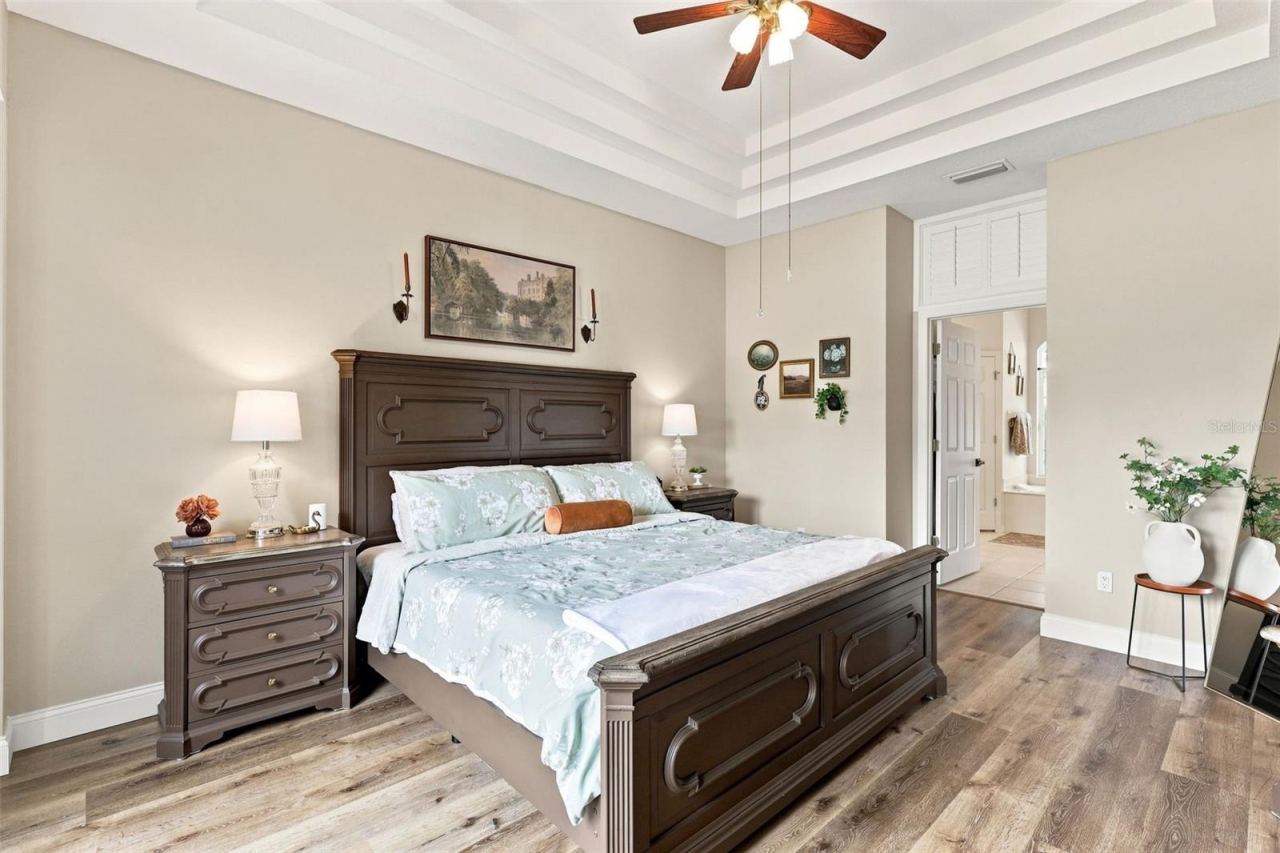 Photo 18 of 20: Primary bedroom suite towards walk-in closets and ensuite bath.