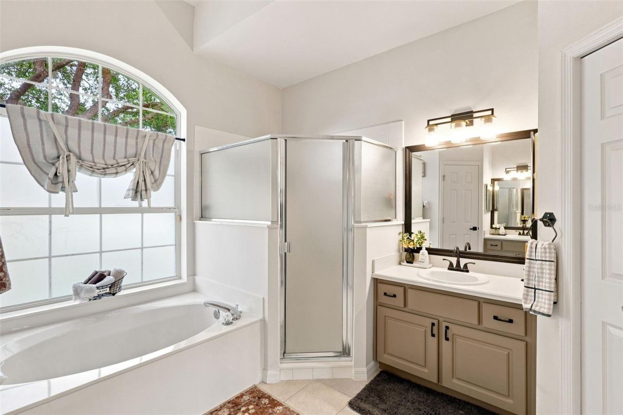 Photo 20 of 20: Primary ensuite bathroom with garden soaking tub and large walk-in shower.