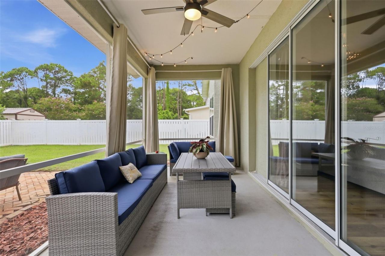 Photo 4 of 20: Large screened in the huge, vinyl fenced backyard.