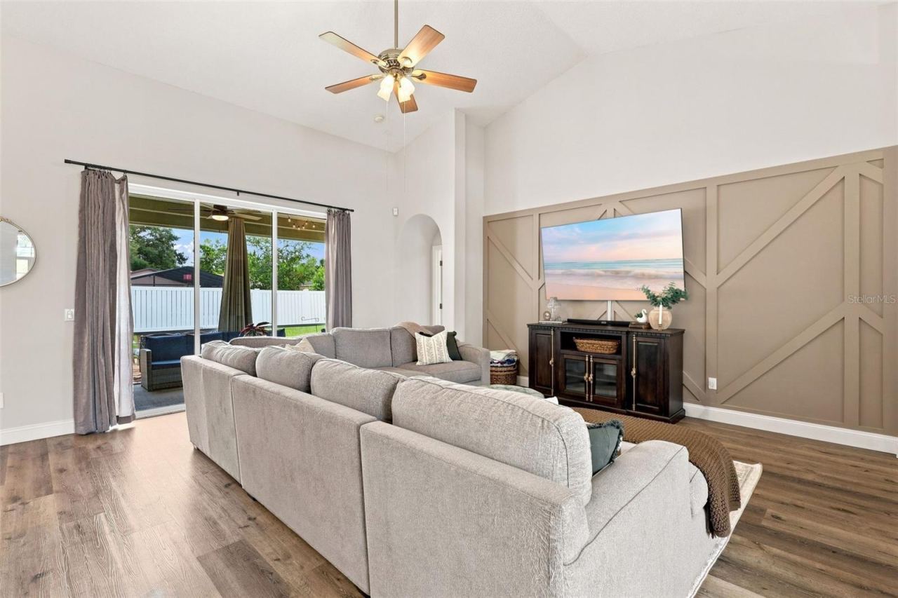 Photo 2 of 20: Main living area with vaulted ceiling and porch access