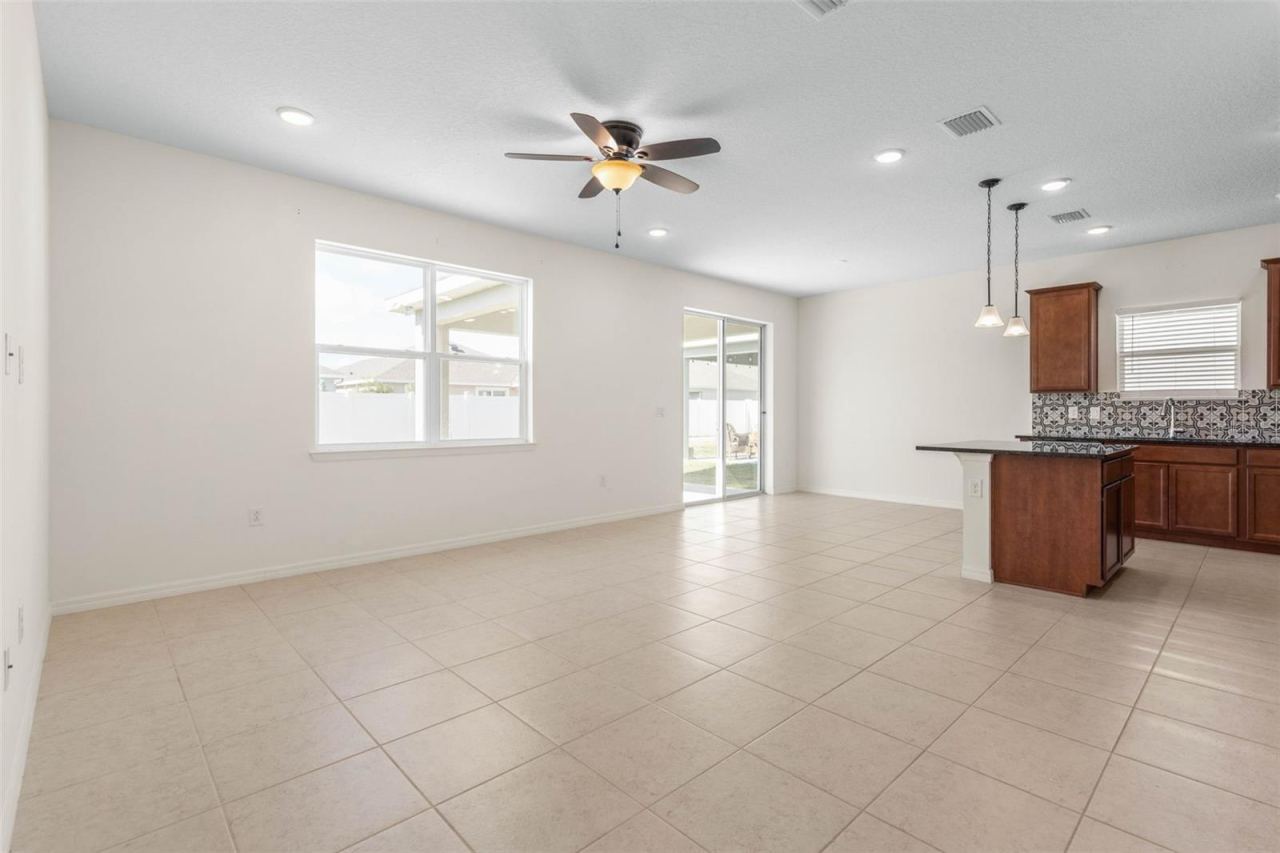 Photo 12 of 20: An open-concept living, dining, and kitchen layout creates a seamless space for everyday living, entertaining, and staying connected while cooking or hosting.