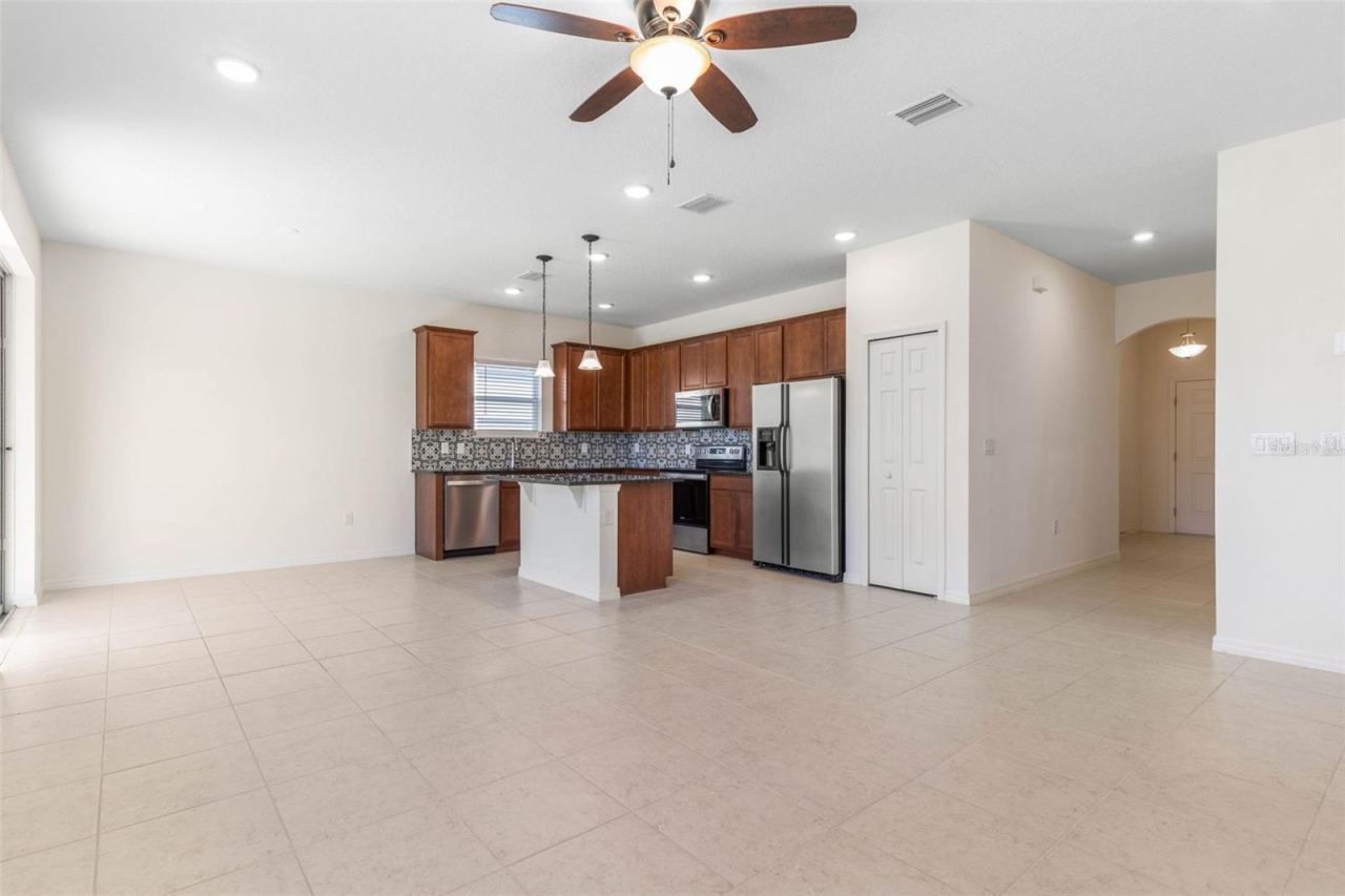Photo 9 of 20: Open-concept living, dining, and kitchen area.