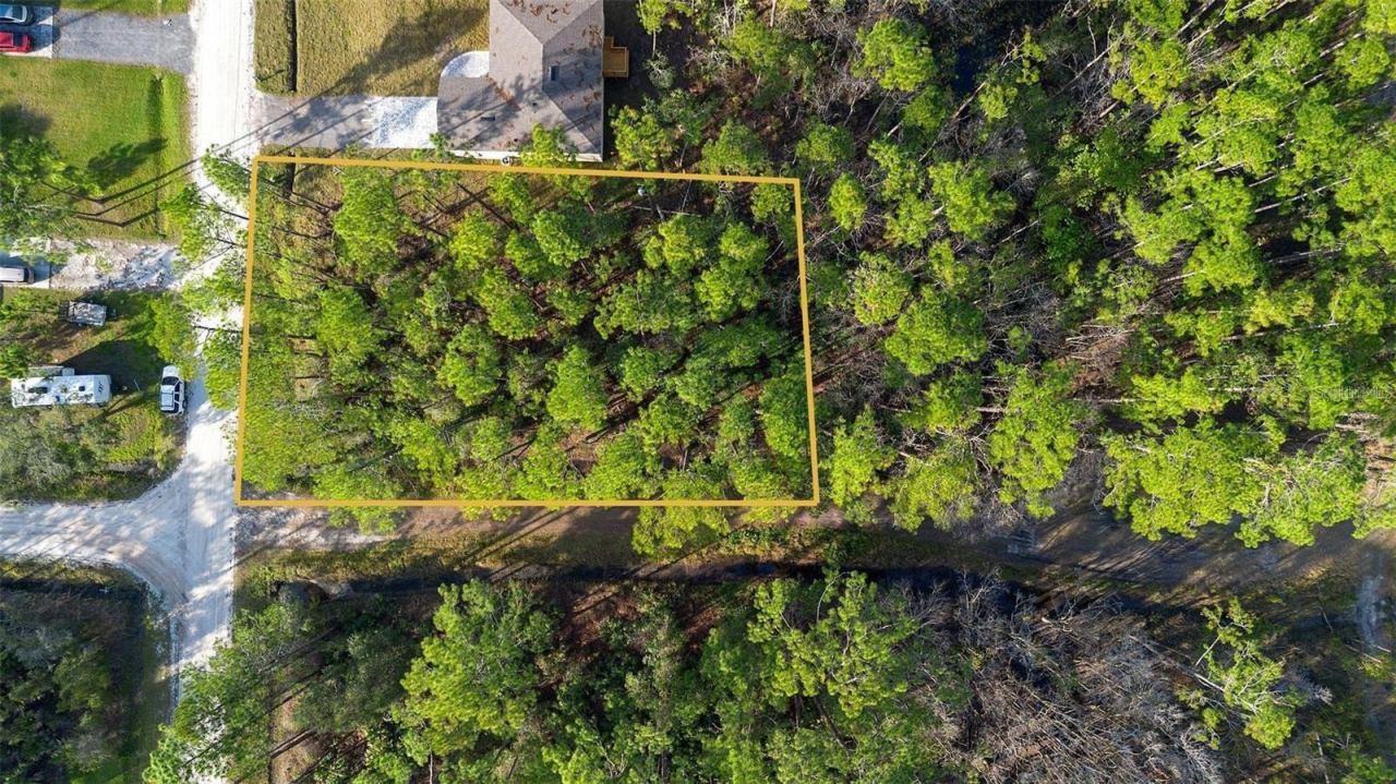 Photo 1 of 6: Aerial view of vacant lot.