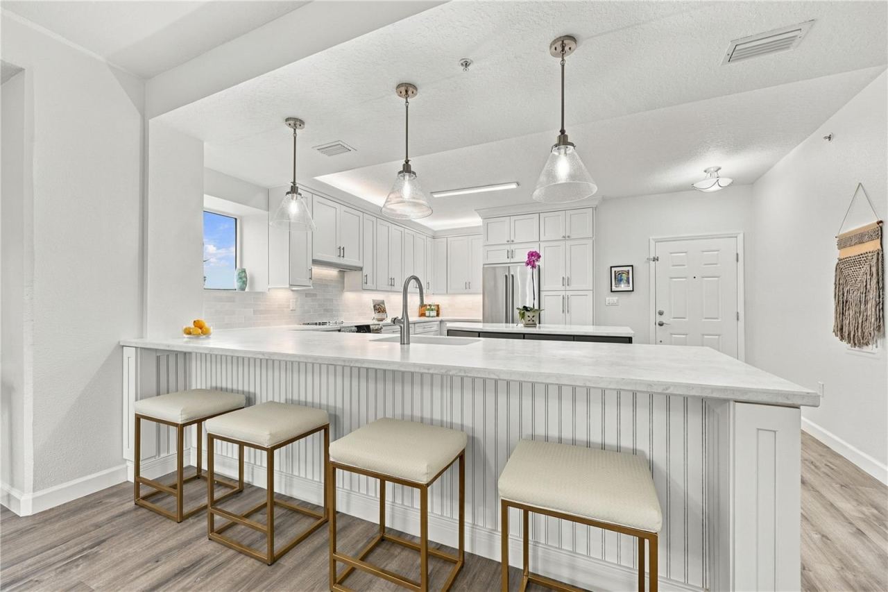 Photo 14 of 20: Kitchen Breakfast Bar with Ample Seating