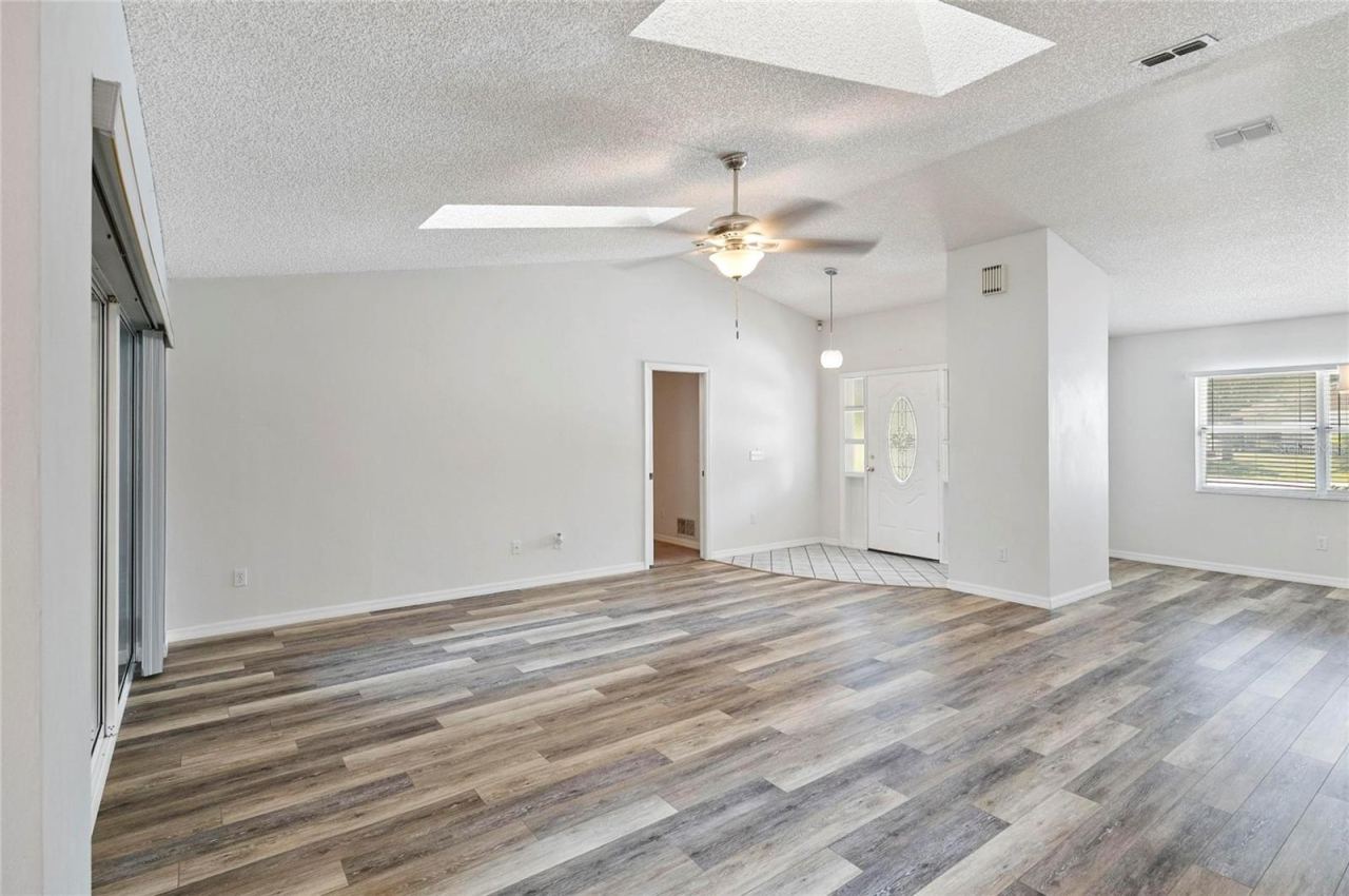 Photo 9 of 20: Living Room, Open Foyer and Dining Room