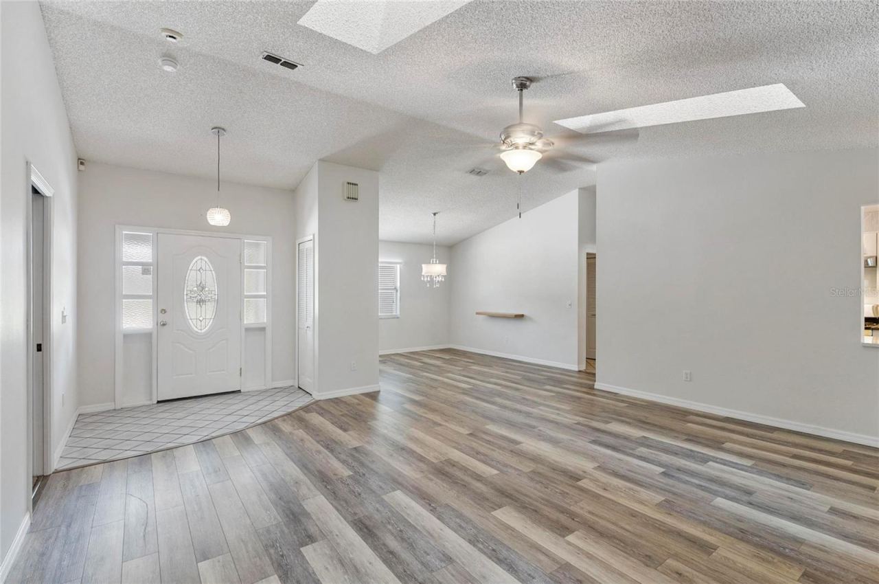 Photo 8 of 20: Open Foyer, Living Room and Dining Room
