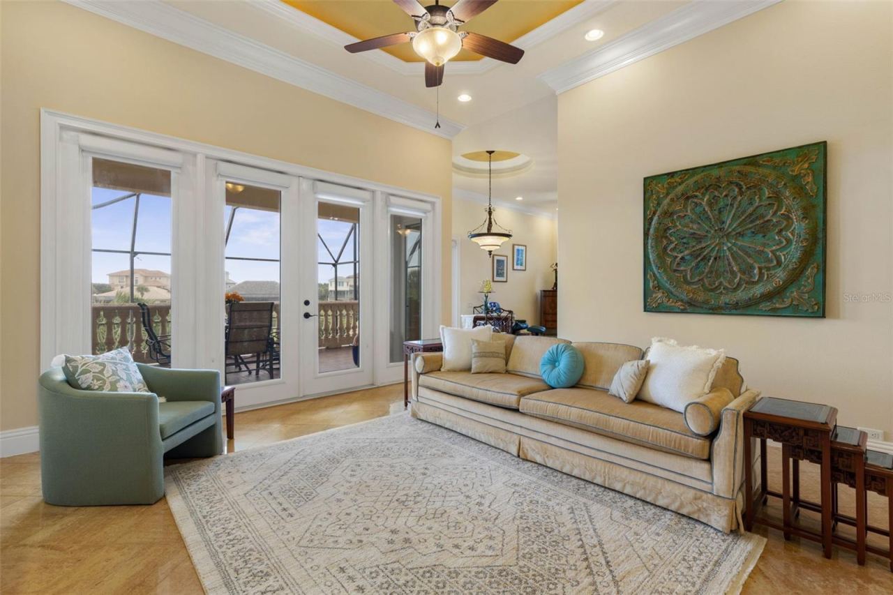 Photo 14 of 20: Family room with french doors leading out to outside lanai