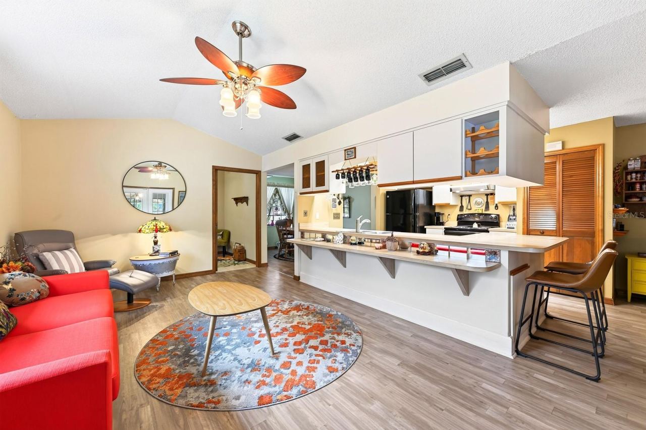 Photo 10 of 20: Overlooking the Family Room, the Kitchen keeps everyone connected.