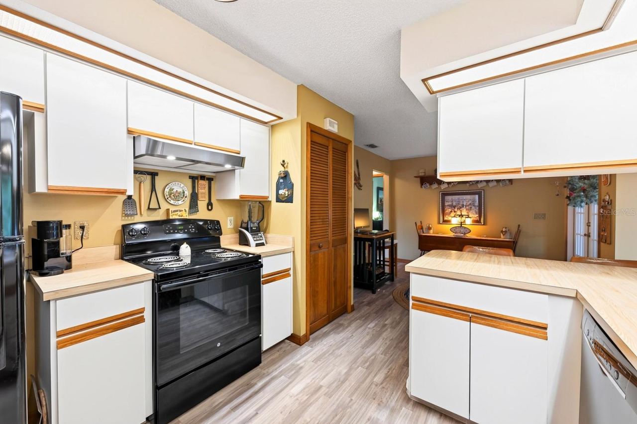 Photo 12 of 20: The large Kitchen offers an ABUNDANCE OF CABINETRY and counter space.